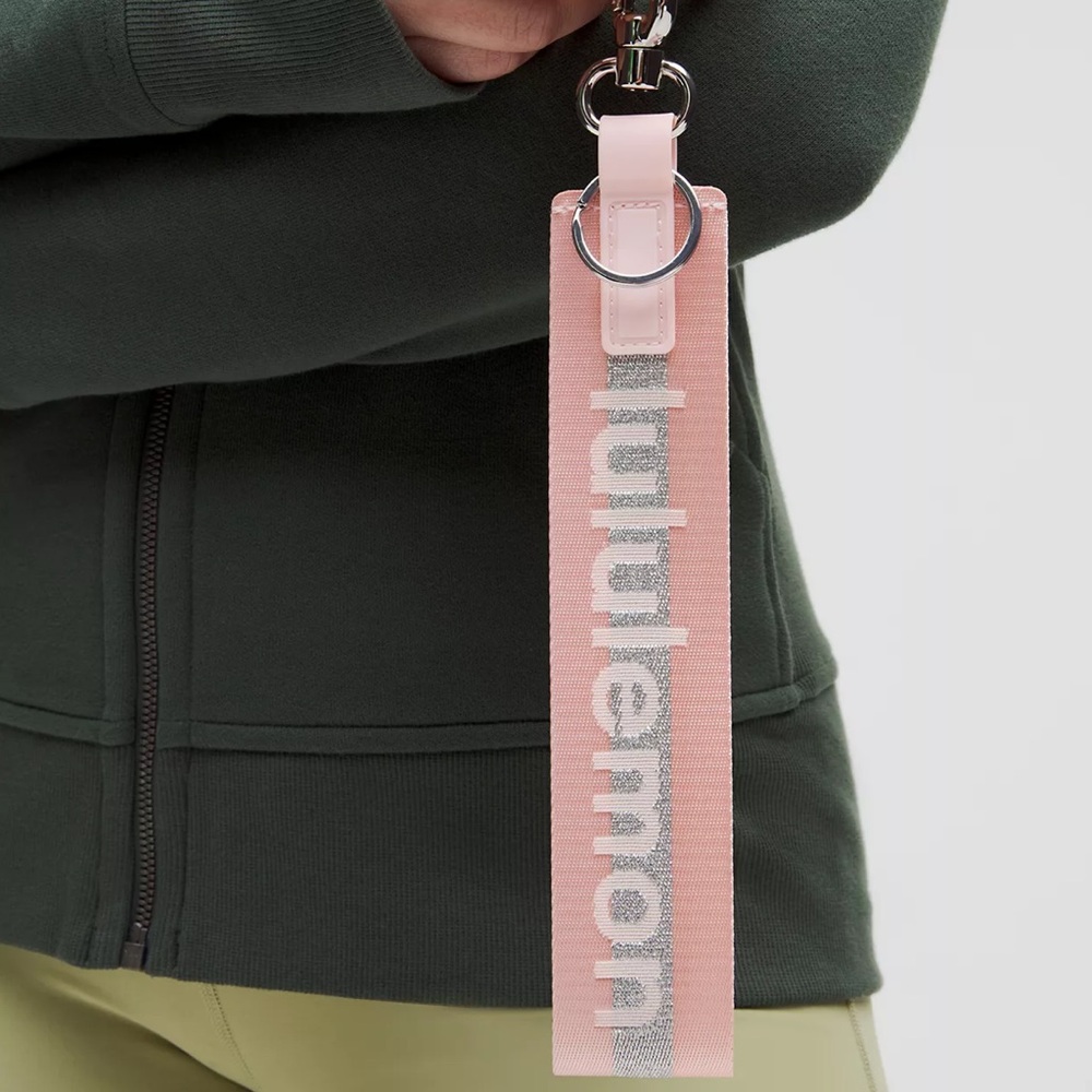 BRAND NEW! Never used! Lululemon Never Lost Keychain wristlet pink and silver